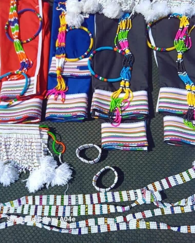 Display of colourful traditional garments and beaded accessories