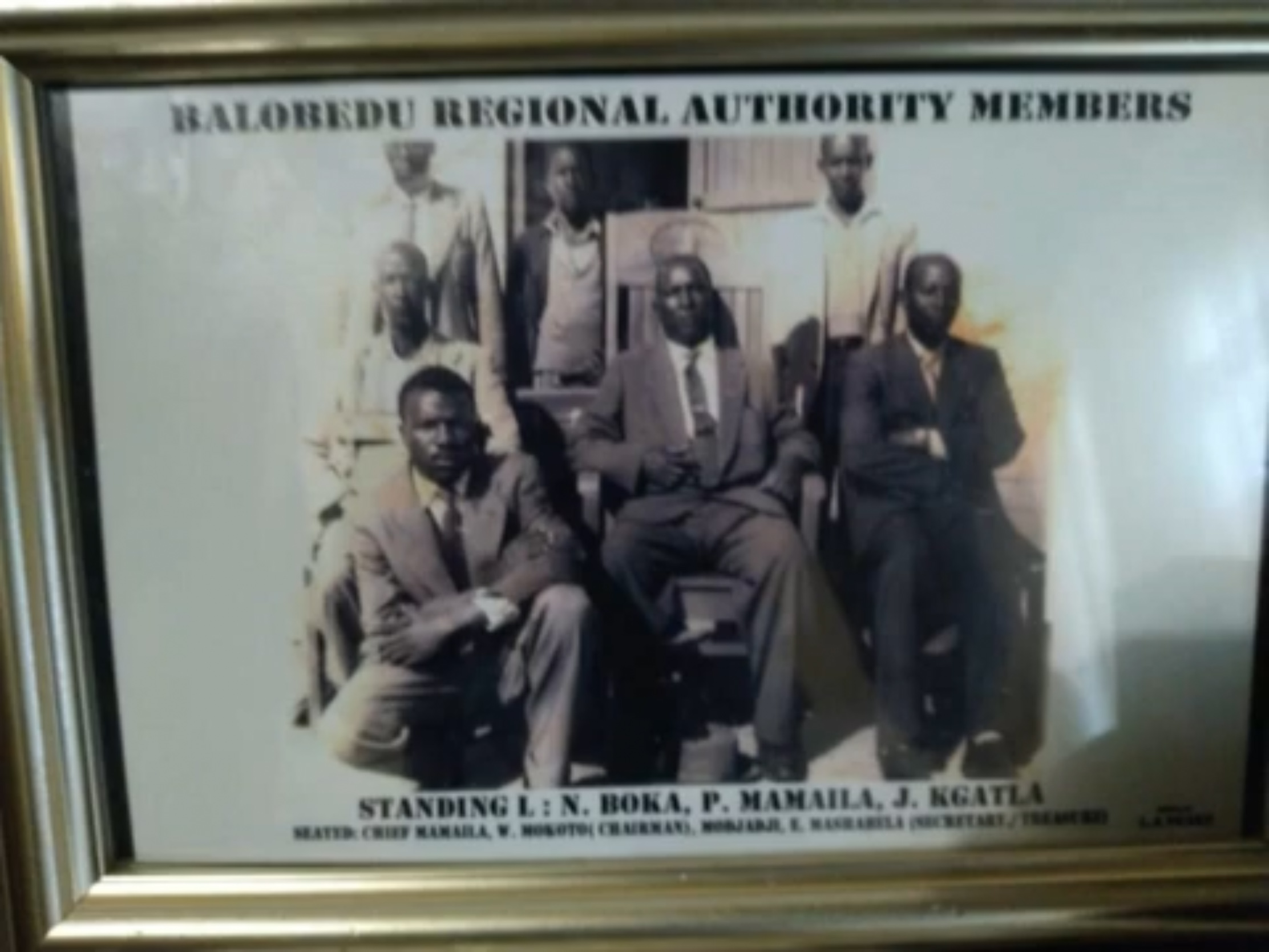 Framed photograph of Balobedu Regional Authority members; W. Mokotu is identified as chairman, seated at the centre